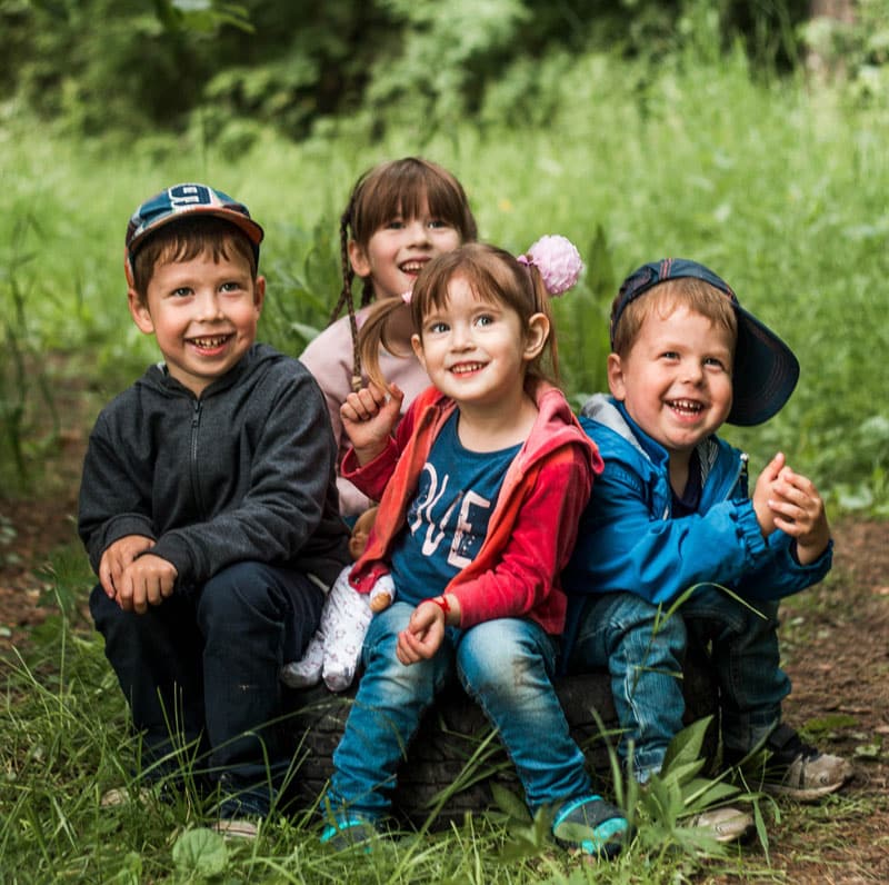 happy children sit on ground happy children sit on ground